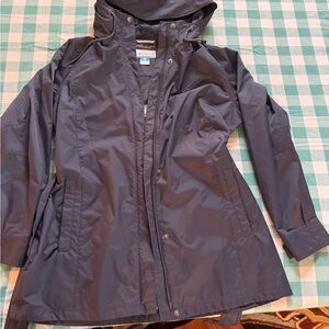 Columbia Women's Dark Blue Hooded Rain Jacket.